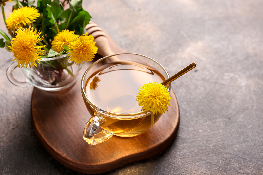 Cup Of Dandelion Tea With Flowers 